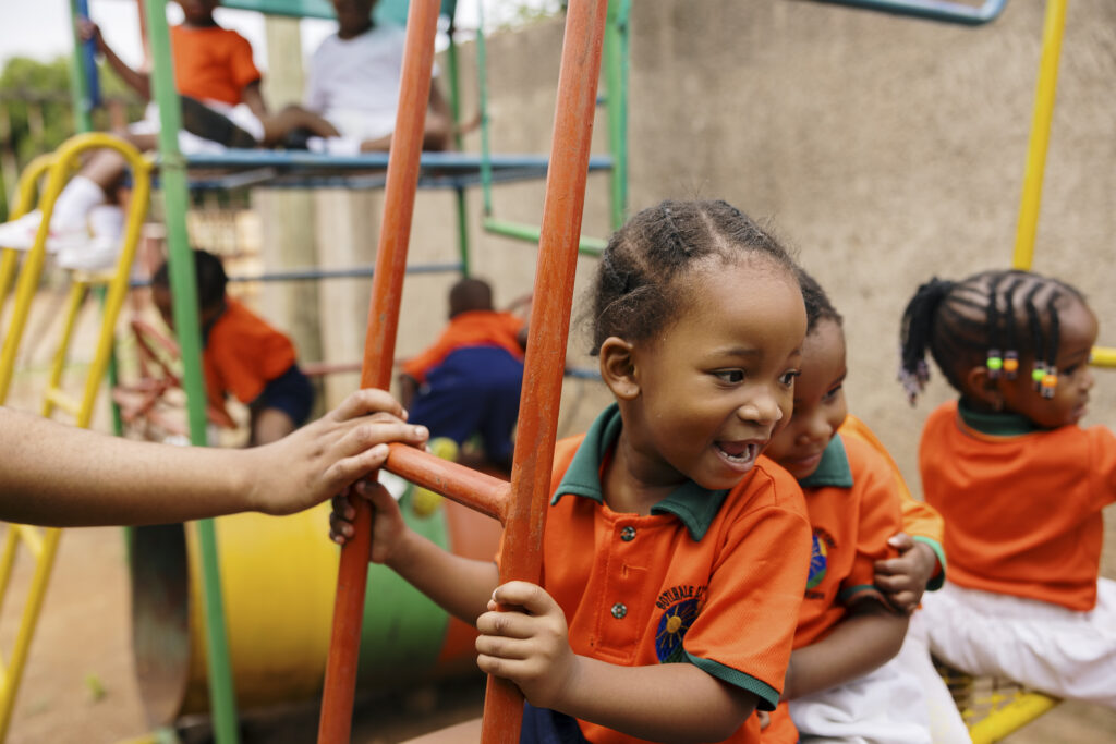 Children laughing and playing on the playground